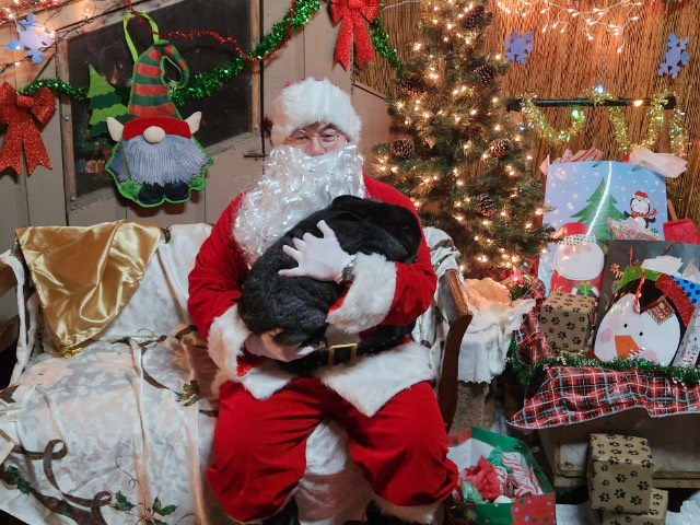Santa sat with a rabbit in his lap