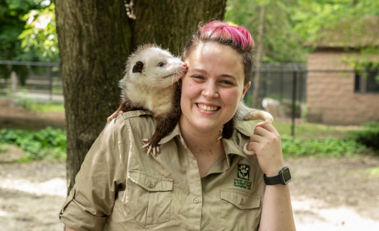 Caroline Cay Adams, education director at The Zoo in Forest Park with Virginia opossum, Cherry.